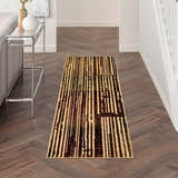 Hallway with Nourison Grafix Brick Multicolor runner rug on wood floor. Modern table and neutral decor.