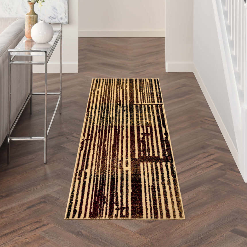 Hallway with Nourison Grafix Brick Multicolor runner rug on wood floor. Modern table and neutral decor.