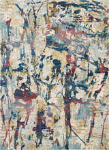 Close-up of Nourison Fusion Cream Multicolor rug. Abstract pattern in cream, blue, gold, and red. Mid-century modern style.