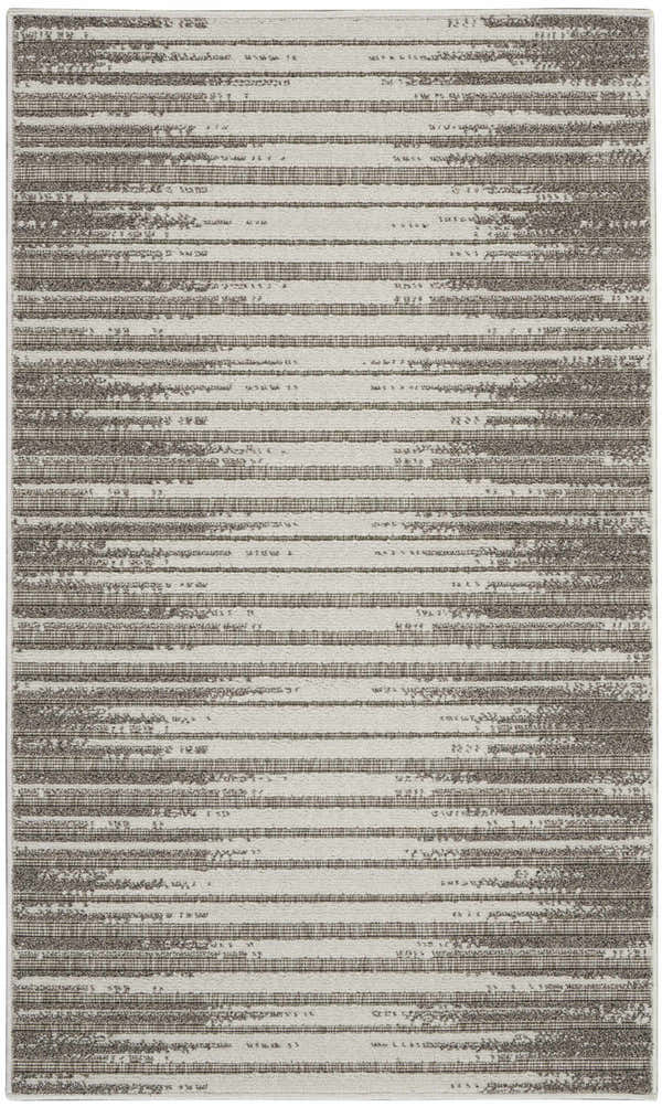 Close-up of Nourison Key Largo Light Grey rug featuring a contemporary striped pattern and subtle texture.