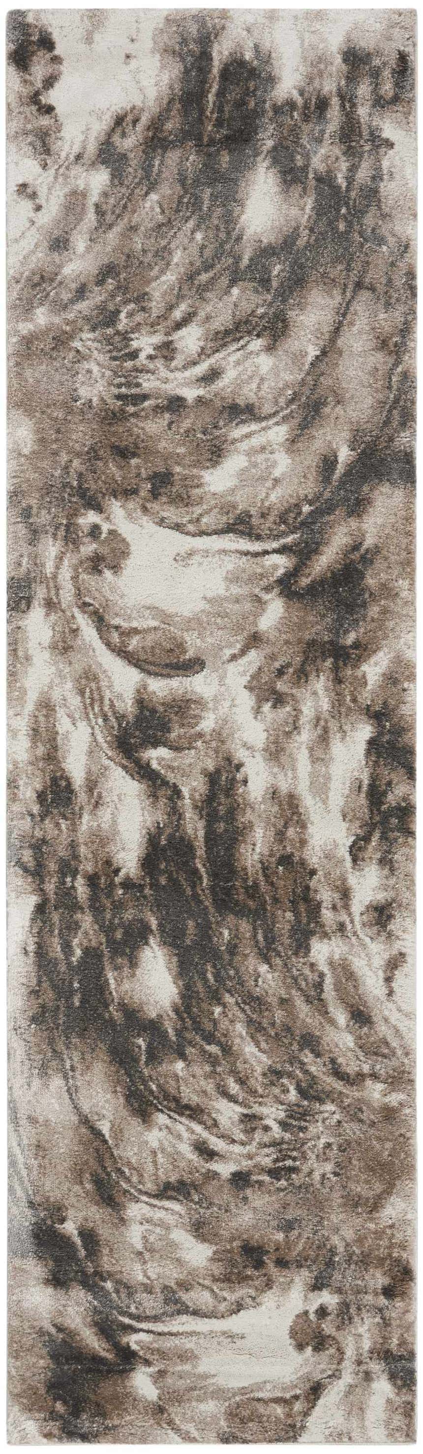 Close-up of the Nourison American Manor rug. Ivory and mocha tones create a modern, swirling pattern.