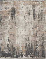 Close-up of the Nourison Tangra Cream Grey rug. Modern design with cream, gray, and hints of gold. Abstract pattern.