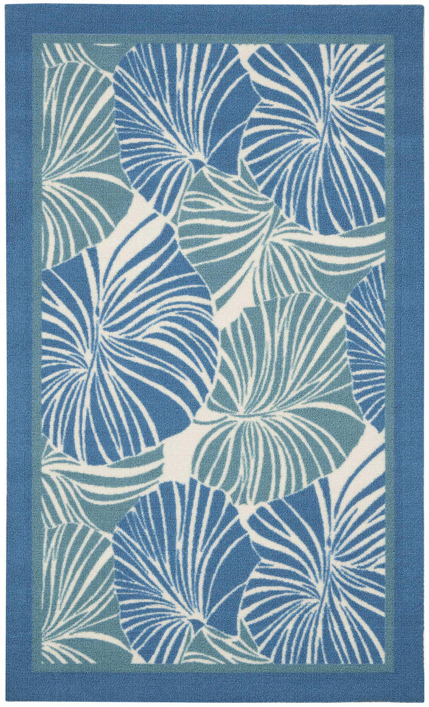 Close-up of Waverly Sun N' Shade Blue Tropical Area Rug with light blue palm leaf pattern and a solid blue border.