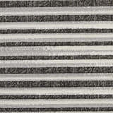 Close-up of the Nourison Key Largo Dark Grey rug showing a striped pattern and textured weave.