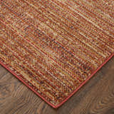 Close up of Feizy Deja Modern Solid Area Rug in brown, red, and tan on a wood floor. Casual, contemporary style. Corner