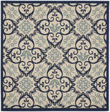 Close-up of the Nourison Caribbean Ivory Navy rug featuring a contemporary floral and scroll pattern.