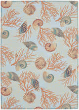 Close-up of Waverly Sun N' Shade Light Blue rug featuring seashells and coral on a light blue background. Coastal style.