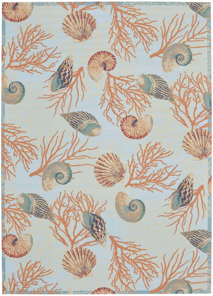 Close-up of Waverly Sun N' Shade Light Blue rug featuring seashells and coral on a light blue background. Coastal style.