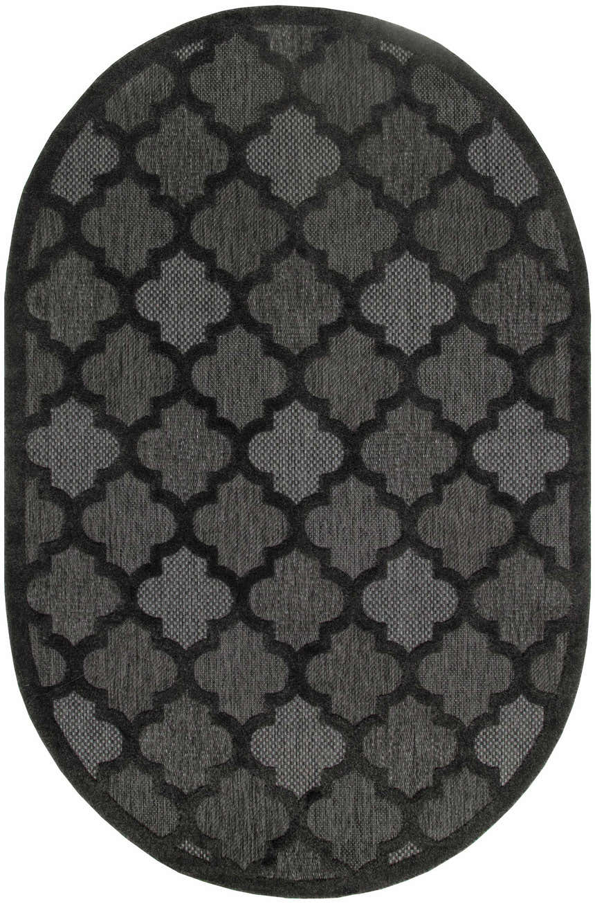 Close-up of the oval Nourison Easy Care Charcoal Black rug featuring a taupe quatrefoil pattern.
