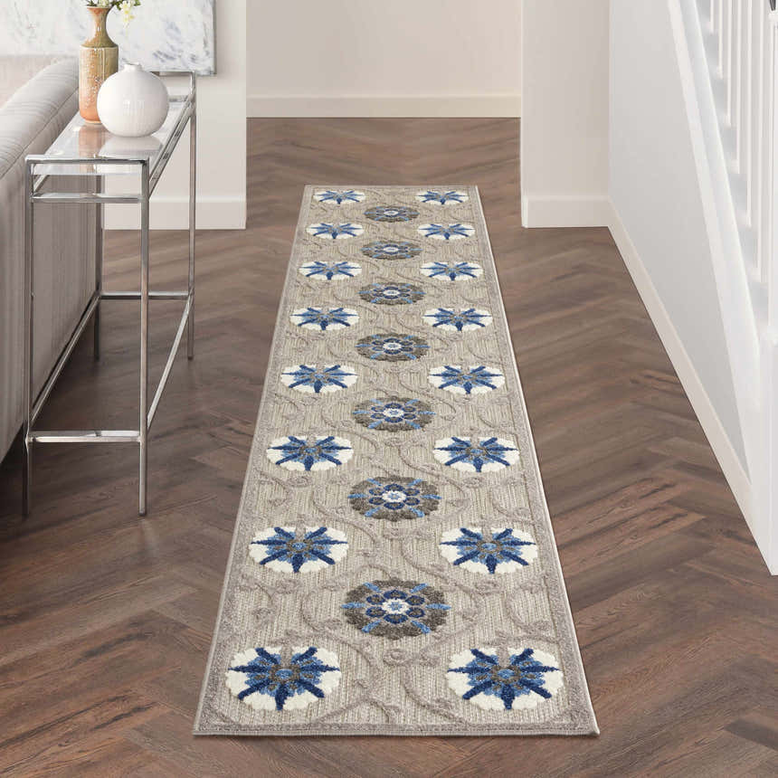 Hallway with Nourison Aloha Grey Blue Contemporary Area Rug runner on dark wood floor.
