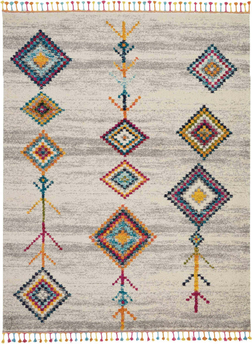 Close-up of Nourison Nomad Cream Grey Tribal rug featuring colorful diamond patterns and playful fringe.