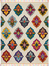Close-up of Nourison Nomad Ivory Multicolor Floral Area Rug with colorful diamond pattern and tassel fringe.