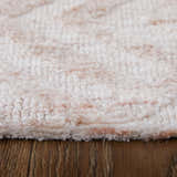 Close-up of the Feizy Colton Modern Diamond Pink/Ivory Area Rug showing its soft texture and subtle pink diamond pattern. Pile
