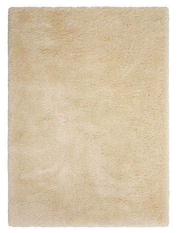 Close-up of the Nourison Yummy Shag Bone Area Rug. Beige, soft shag texture, and rectangular shape.