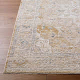 Close-up of Rhody Luxe Rug in light silver and sterling gray on wood floor. Traditional farmhouse style. Front