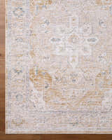 Close-up of the Rhody Luxe Rug showing its light silver, sterling gray, and tan traditional pattern and soft texture. Corner