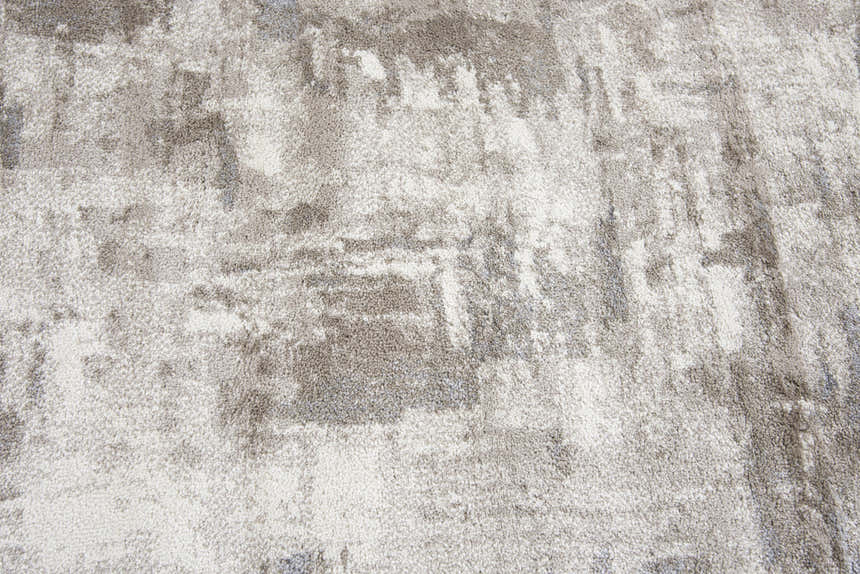 Close-up of the Rizzy EN7258 area rug, featuring a contemporary beige, ivory, and gray abstract pattern. Texture