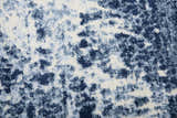 Close-up of the Rizzy EN7262 area rug. Contemporary design in shades of blue, navy, and ivory. Soft, textured polypropylene. Texture