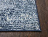 Close up of Rizzy EN7262 area rug. Contemporary design in blue, ivory, and navy colors. Corner