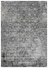 Close-up of the Rizzy EN7272 area rug featuring a distressed black, ivory, and light gray farmhouse design. Design-Rectangle