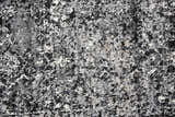 Close-up of Rizzy EN7272 area rug showing its black, ivory, and light gray abstract pattern and soft, textured pile. Texture
