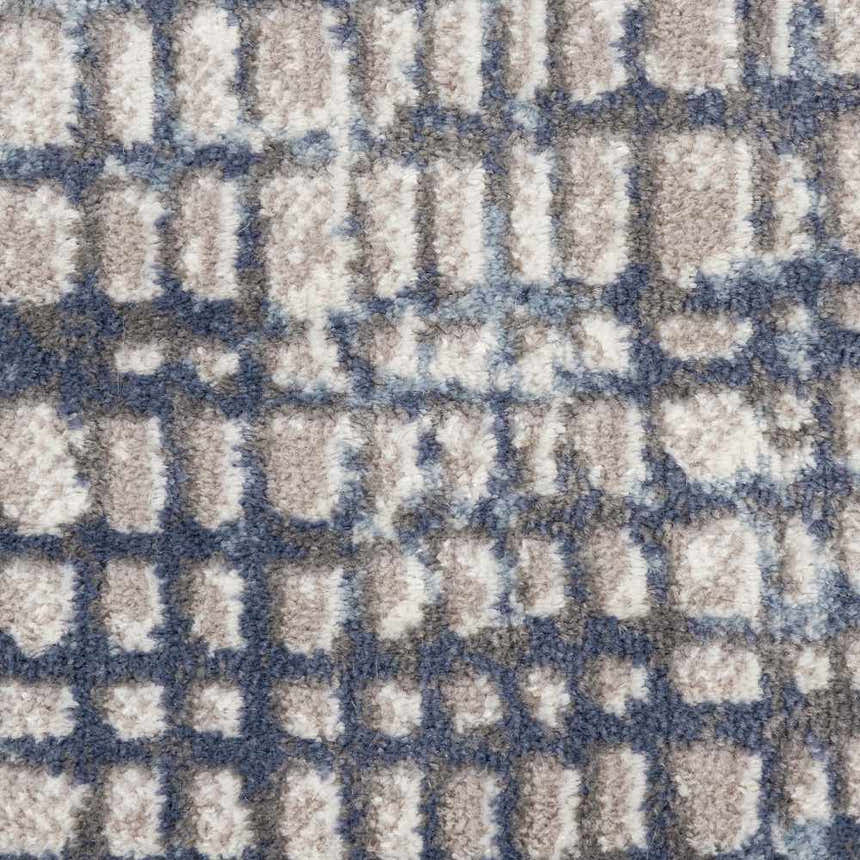 Close-up of the Nourison Urban Decor Grey Ivory Rug, featuring a modern, geometric pattern and soft, textured pile.