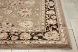Close-up of the Nourison Ararat Grey Persian Indoor Area Rug, featuring a floral design and brown border.
