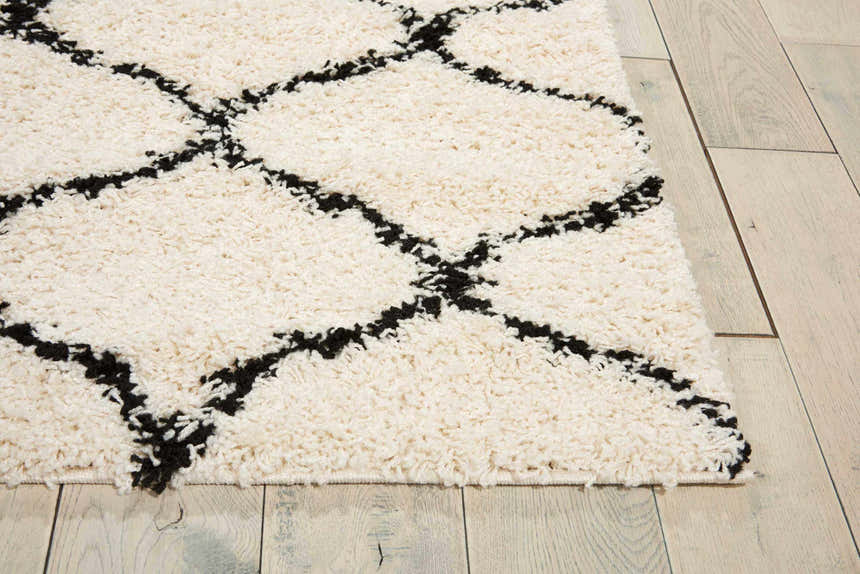 Close up of Nourison Windsor Ivory Shag Rug. Features a chestnut diamond pattern and plush, soft texture.