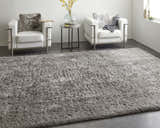Modern living room scene with a gray Feizy Darian rug, white chairs, and a round side table. Roomscene-Rectangle