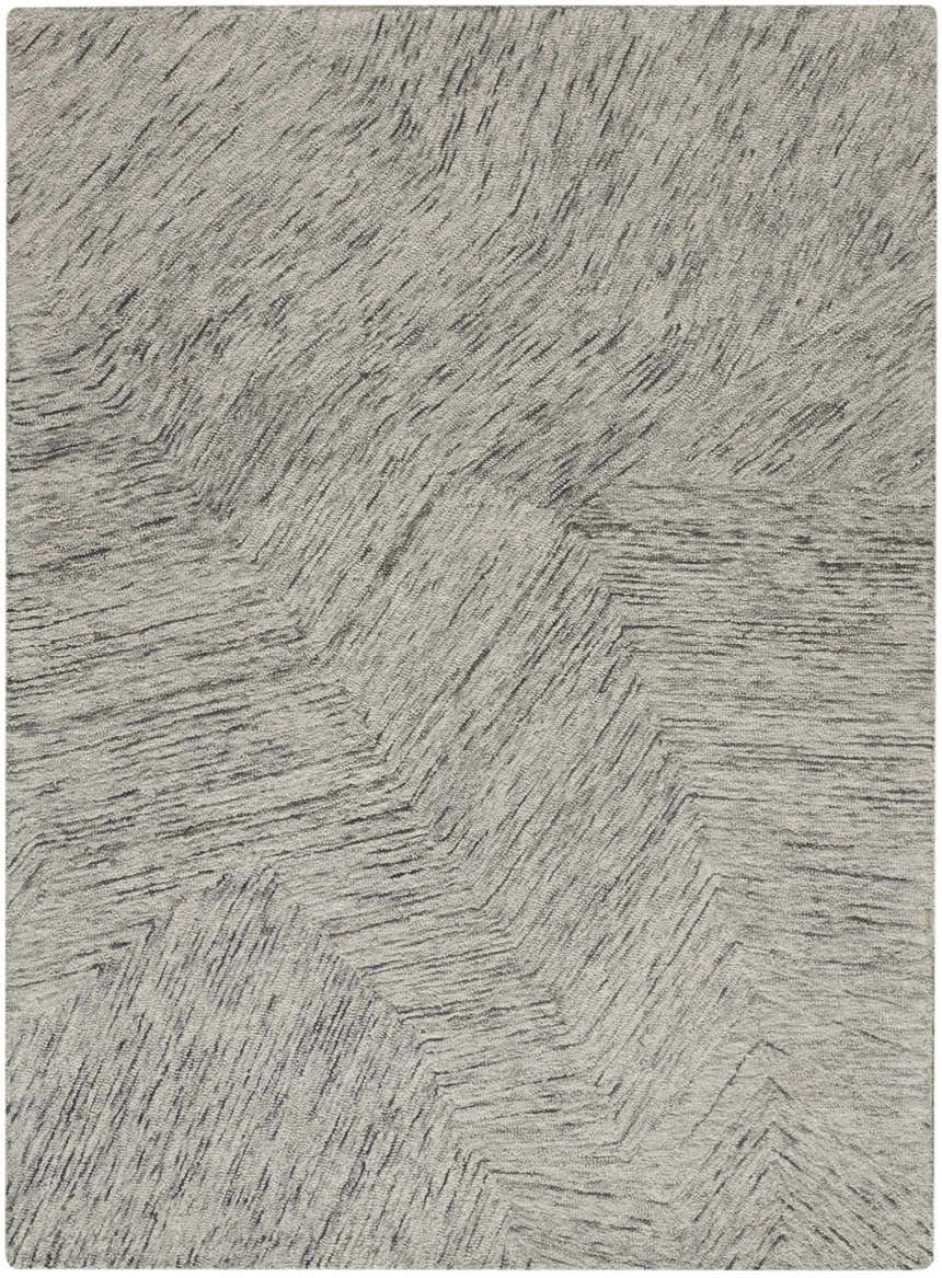 Close-up of the DKNY Pure Angles Grey rug. Modern design with gray angles and linear texture. Handmade pile rug.