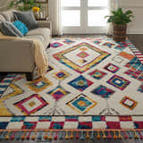 Living room scene with a beige sofa and Nourison Nomad Ivory Multicolor Tribal Area Rug.