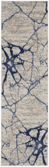 Close-up of Calvin Klein River Flow rug; ivory, blue abstract pattern. Modern, machine-made polypropylene rug.