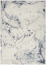 Close-up of the Nourison Motion Ivory Blue rug, showcasing its abstract, marbled pattern and low pile texture.