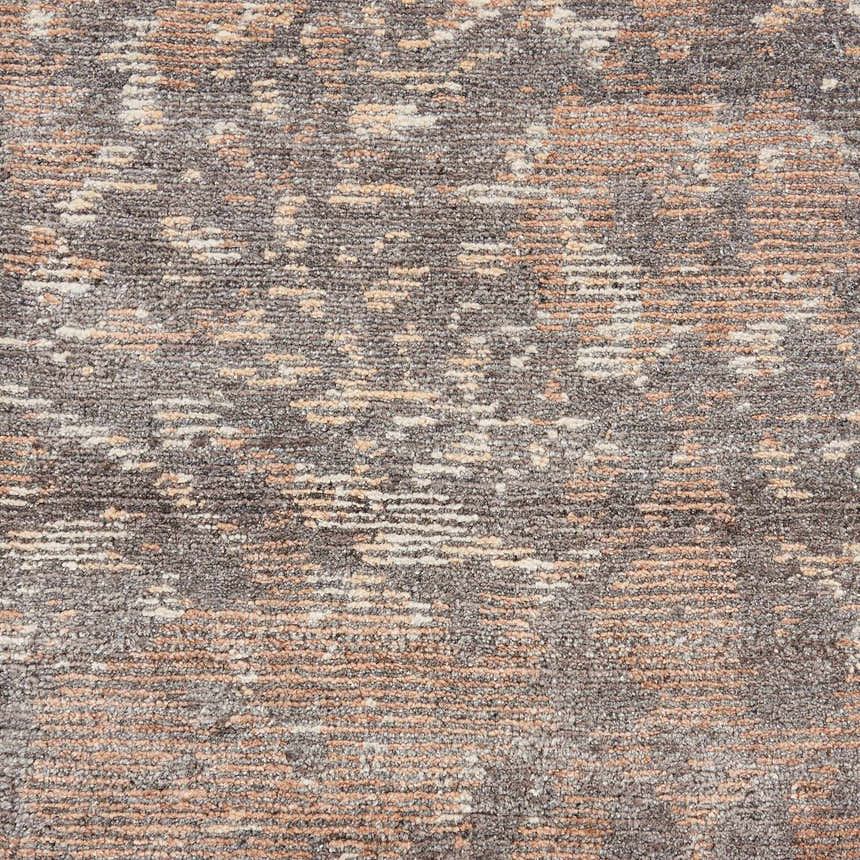 Close-up of the Nourison Lucent Flint Vintage Area Rug showing texture, flint gray, peach, and cream colors.