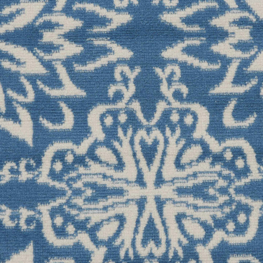 Close-up of Nourison Jubilant Ivory Blue rug showing farmhouse design, pattern and texture.