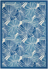 Close-up of the Waverly Sun N' Shade Blue Tropical Area Rug, featuring a light blue floral pattern on a white background.