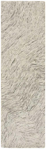 Close-up of the DKNY Pure Angles Grey rug. Handmade pile rug with a subtle, modern angled pattern.