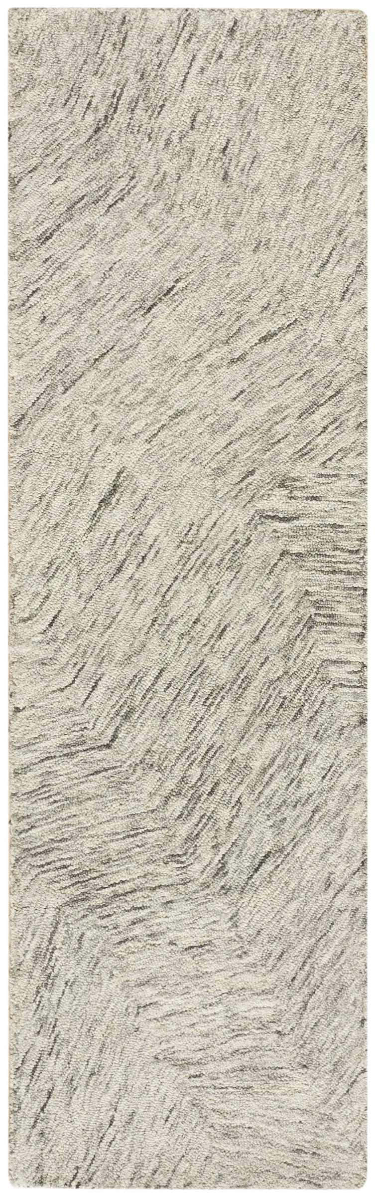 Close-up of the DKNY Pure Angles Grey rug. Handmade pile rug with a subtle, modern angled pattern.