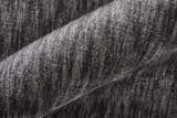 Close-up of the textured Feizy Marlowe rug in gray and taupe, showing the hand-woven chevron pattern. Texture