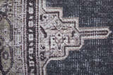 Close up of Feizy Percy rug showing gray, ivory, and taupe medallion pattern and woven texture. Texture