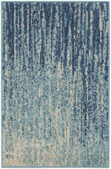 Close-up of the Nourison Passion Navy Light Blue rug. Features a modern, abstract design in shades of navy, light blue, and beige.
