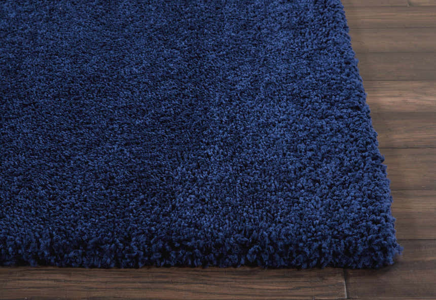 Close-up of the plush texture and rich navy color of the Nourison Malibu Shag Area Rug.