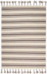 Close-up of the handmade Nourison Rio Vista rug with chestnut stripes and tasseled edges. Wool material.
