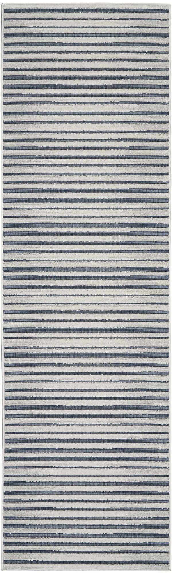 Close-up of the Nourison Key Largo Blue Contemporary Area Rug, showcasing its light blue striped pattern and soft texture.