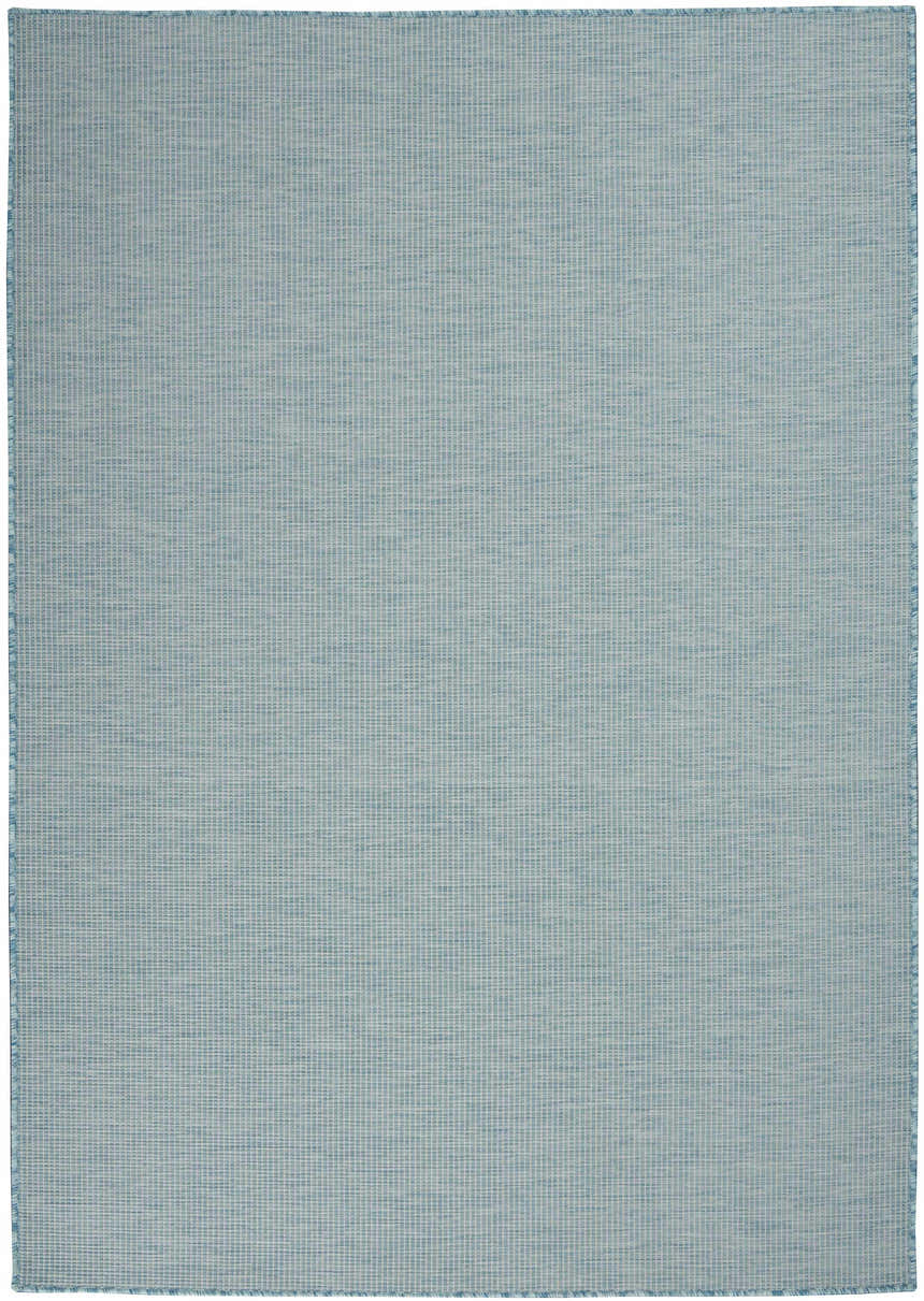 Close-up of Nourison Positano Aqua rug showing its woven texture, light blue color, and subtle grid pattern.