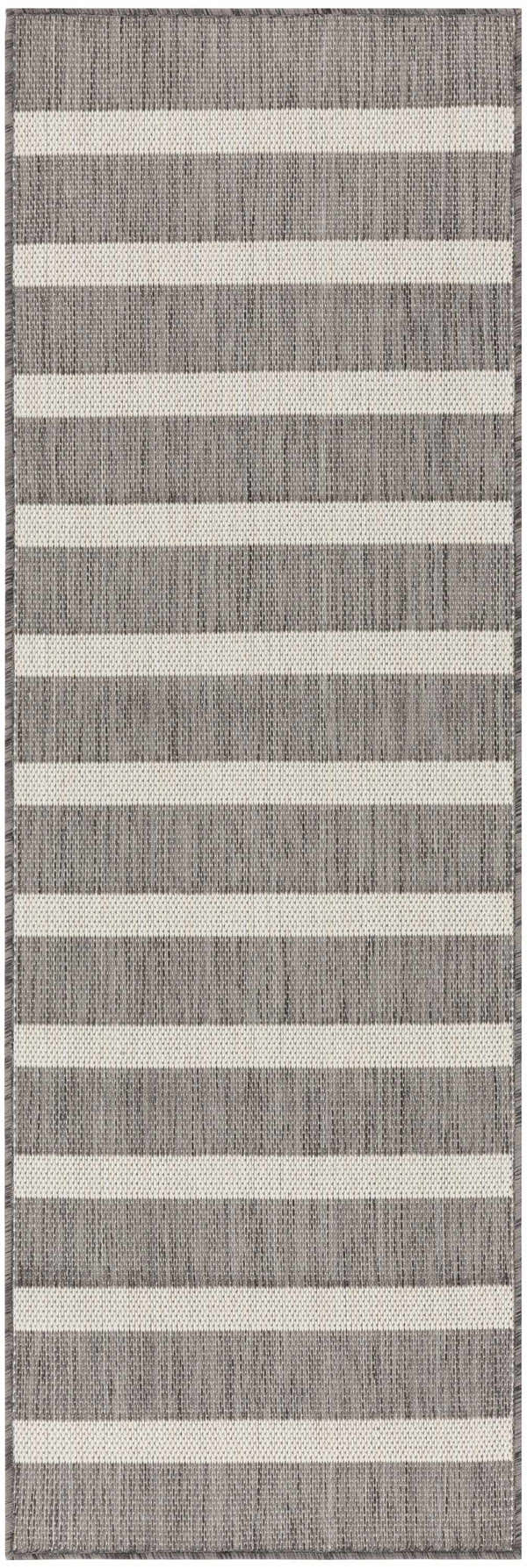 Close-up of the textured Nourison Positano Charcoal Ivory rug with horizontal taupe and ivory stripes.