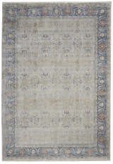 Close-up of the Nourison Starry Nights Grey Vintage Area Rug featuring a floral border and distressed, intricate pattern.