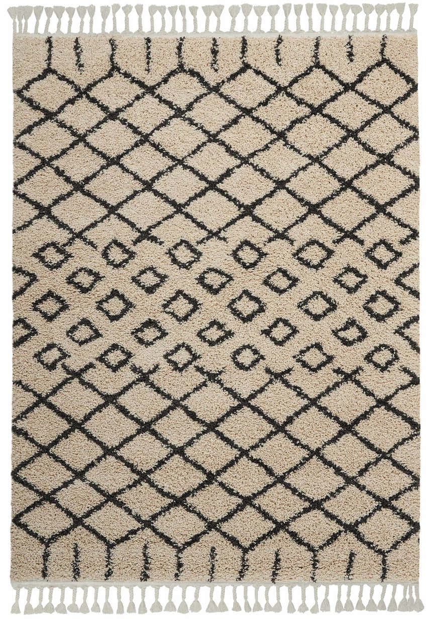 Close-up of Nourison Moroccan Shag Cream Tribal Rug featuring a diamond pattern and fringe. Soft, textured pile.