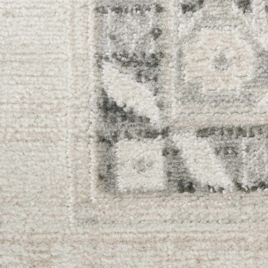 Close up of the high pile Nourison Serenity Home Ivory Grey Vintage Area Rug showing texture and pattern.
