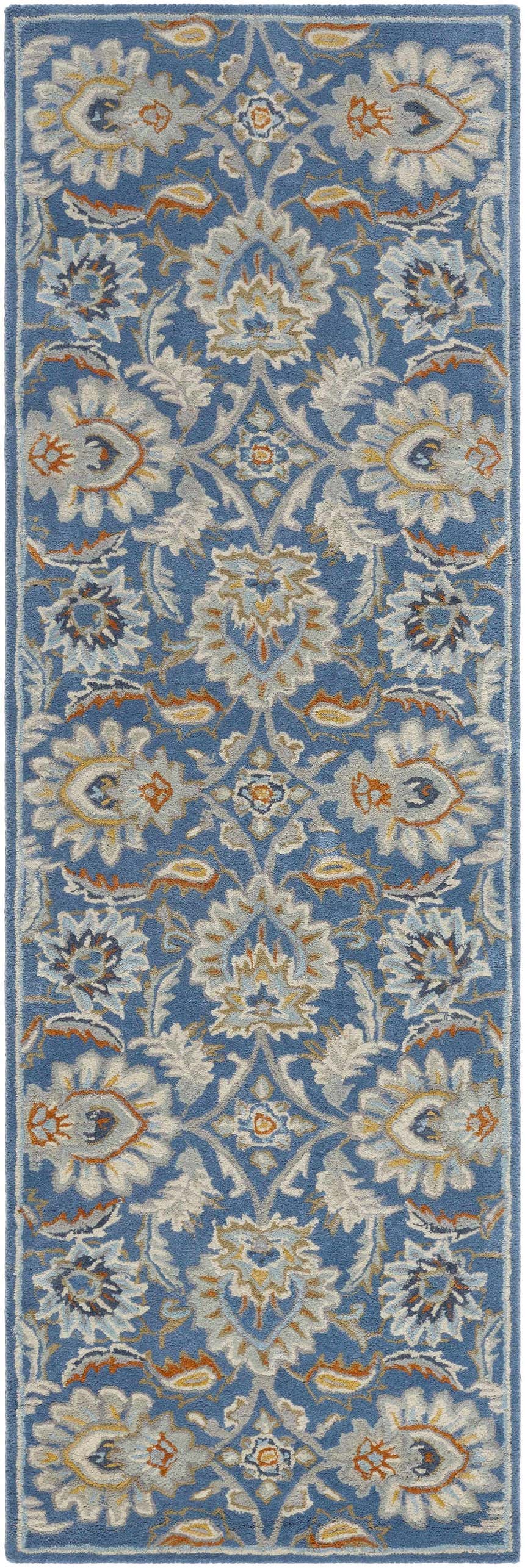 Close-up of the Fanny Area Rug. Hand-tufted wool rug in beachhouse blue with traditional beige, caramel, and gray floral pattern. Design-Runner-268